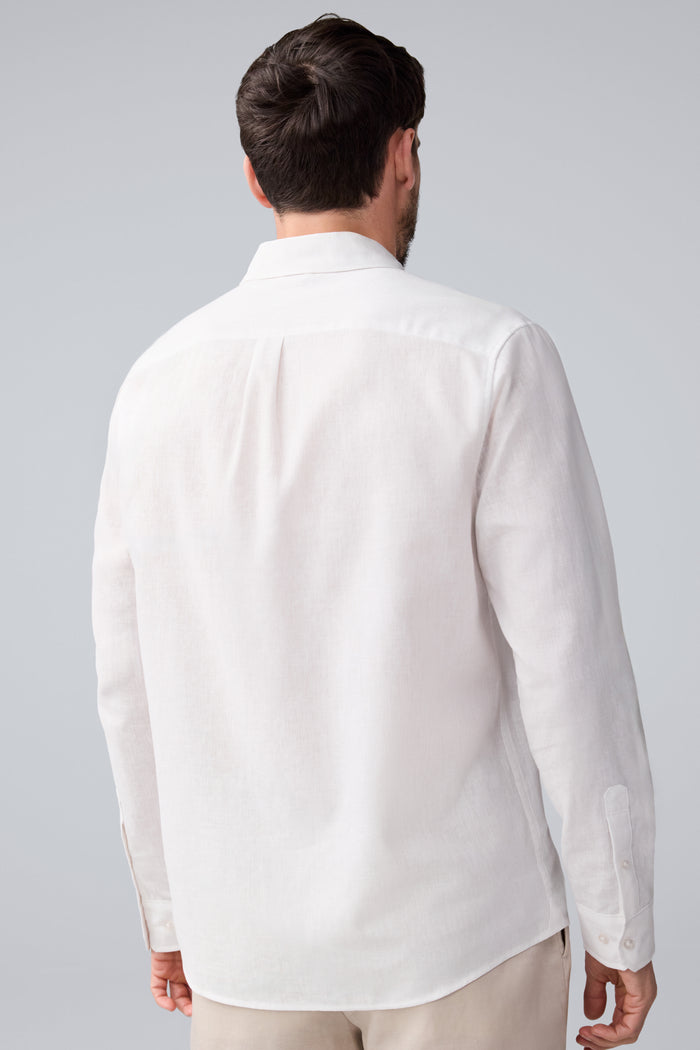 Back view of a man wearing Tech Linen Button Up in Bright White