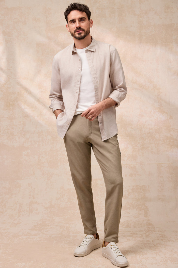 Full front view of a man wearing Tech Linen Button Up