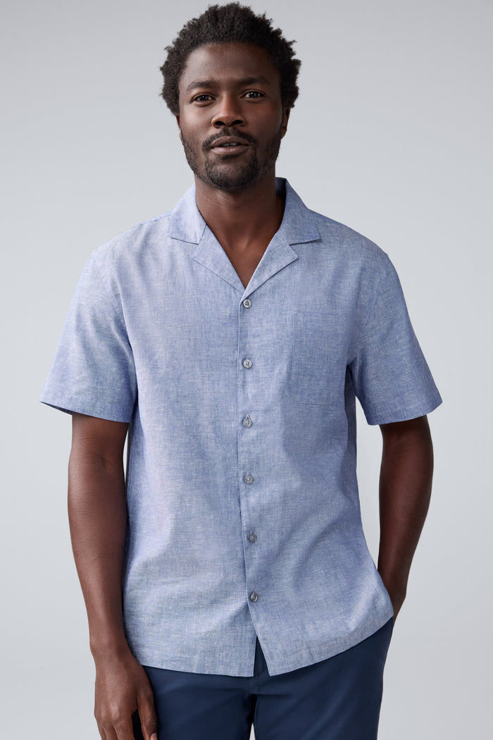 Front view of a man wearing Tech Linen Camp Shirt in Wild Rapids