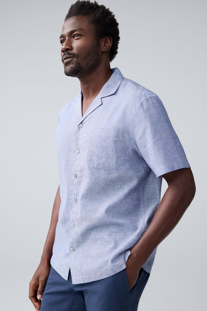 Side view of a man wearing Tech Linen Camp Shirt in Wild Rapids