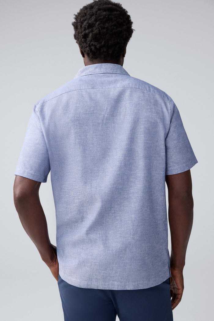 Back view of a man wearing Tech Linen Camp Shirt in Wild Rapids