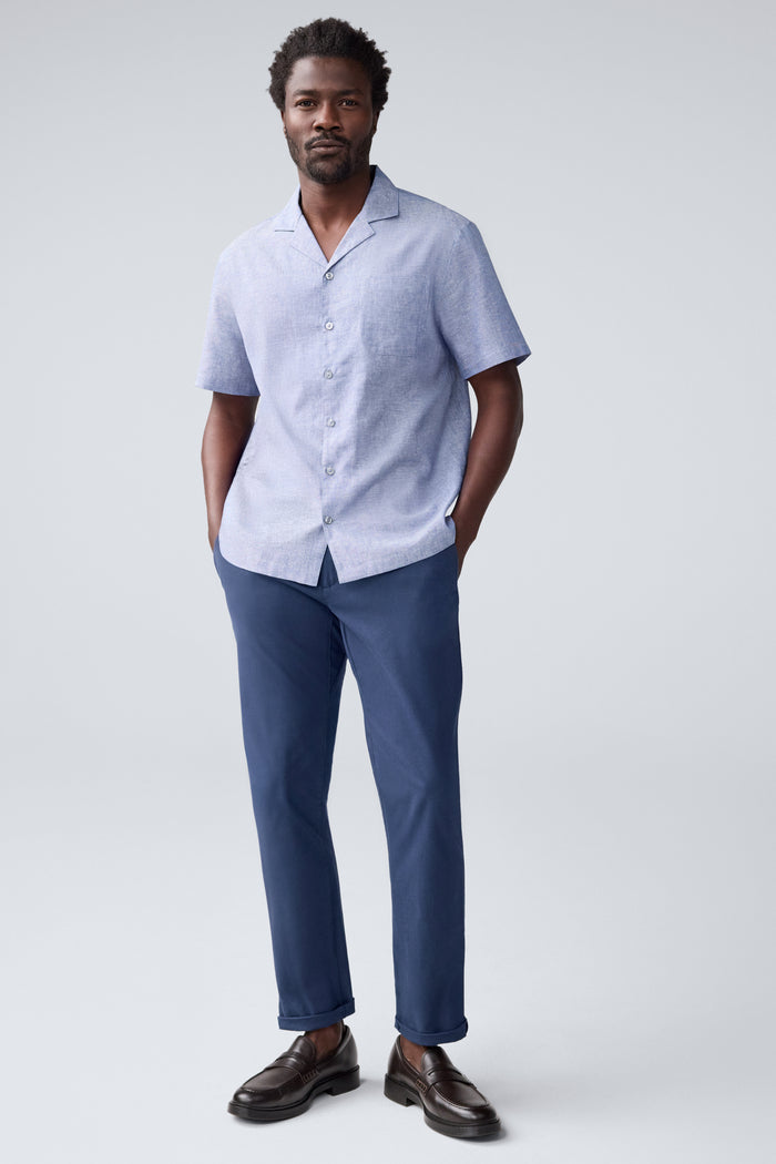 Full front view of a man wearing Tech Linen Camp Shirt in Wild Rapids