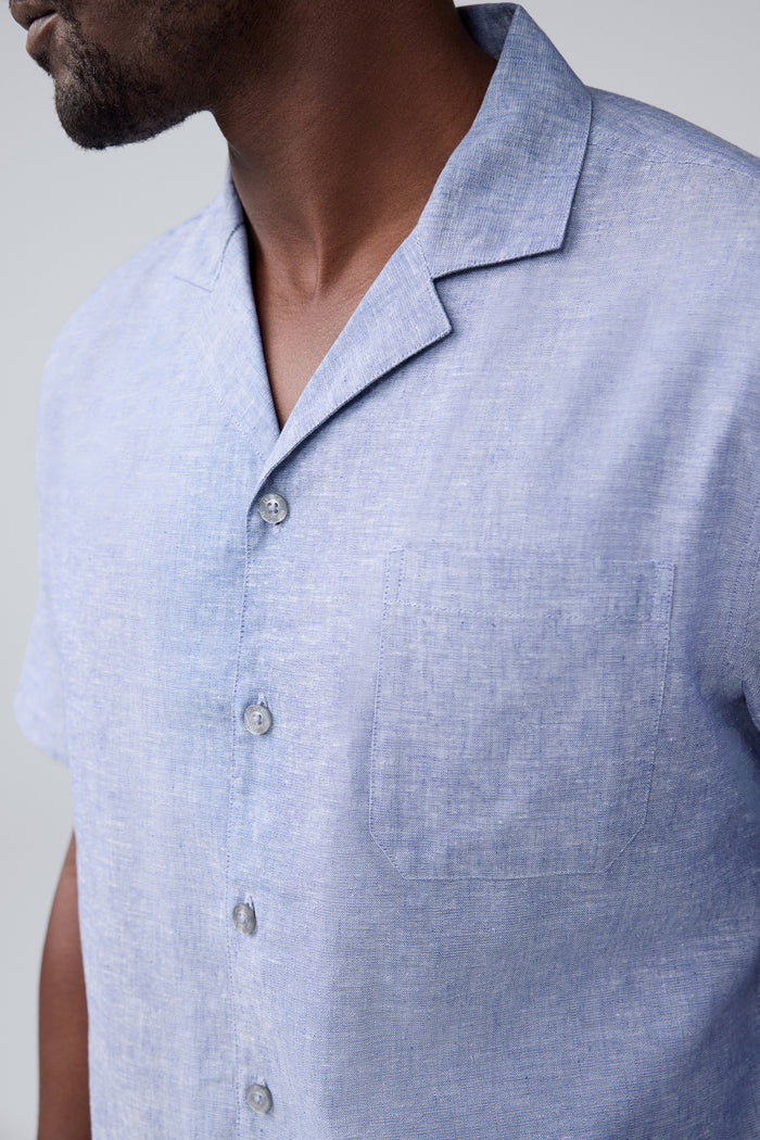 Detailed view of a man wearing Tech Linen Camp Shirt in Wild Rapids