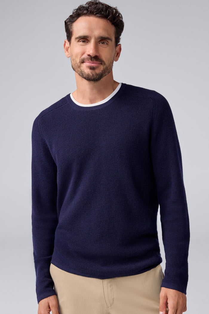 Front view of a man wearing Tech Merino Waffle Crew Neck Sweater in Total Eclipse