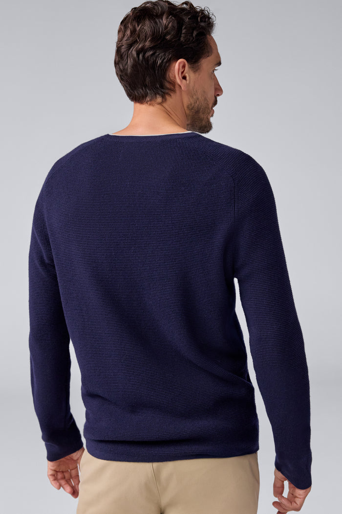 Back view of a man wearing Tech Merino Waffle Crew Neck Sweater in Total Eclipse