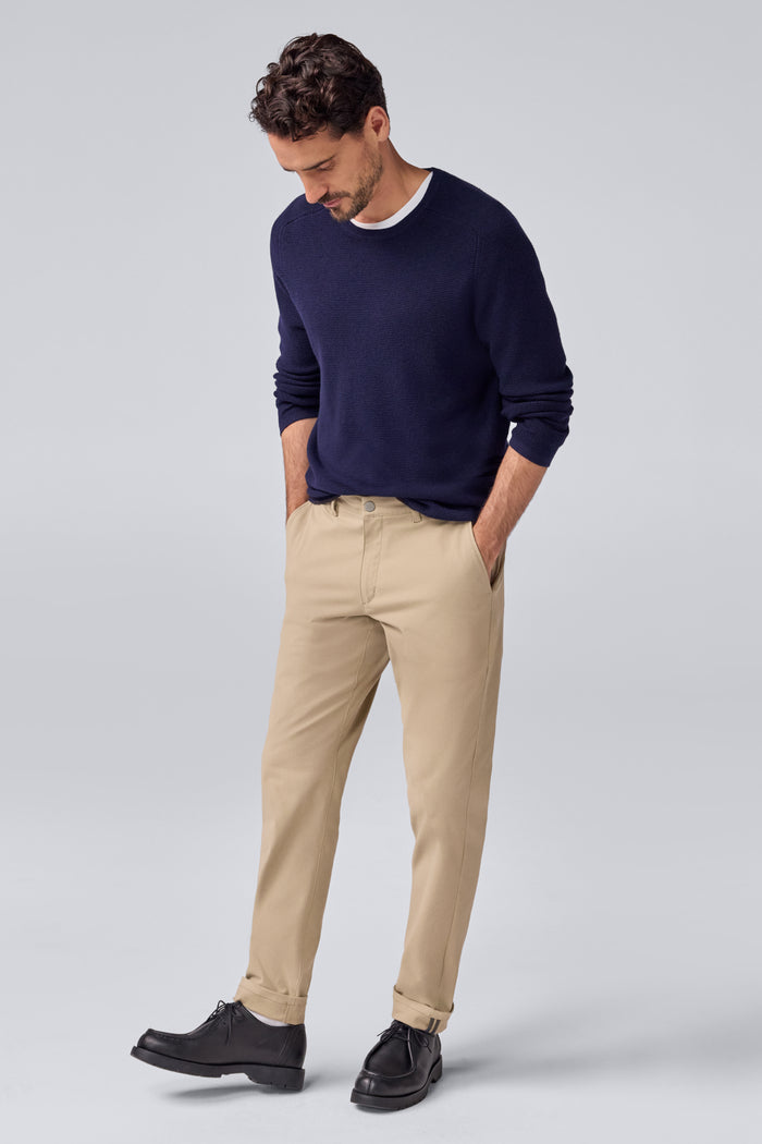 Full front view of a man wearing Tech Merino Waffle Crew Neck Sweater in Total Eclipse