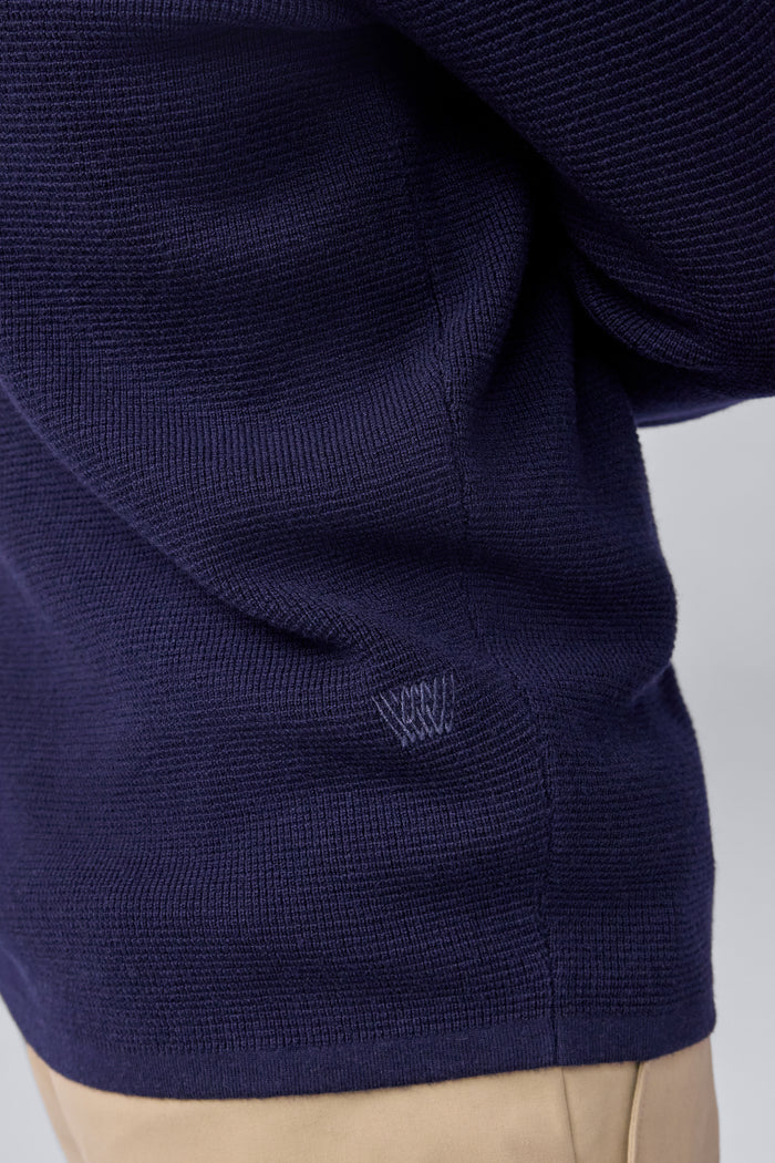 Mack weldon logo on the side of Tech Merino Waffle Crew Neck Sweater in Total Eclipse