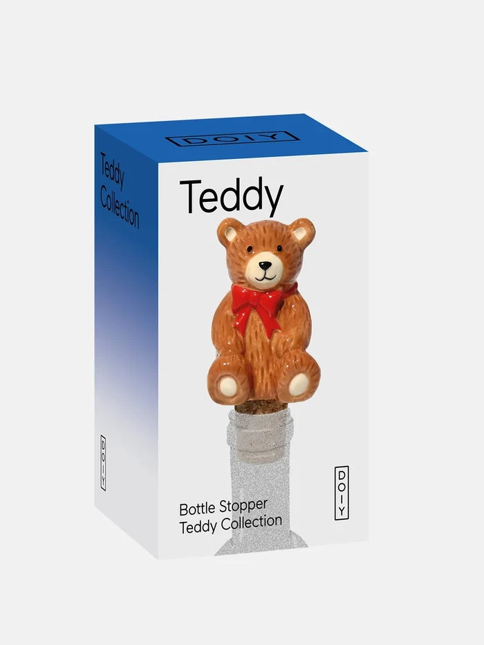 Teddy bear bottle stopper with packaging labeled 'Teddy Collection' on a white background