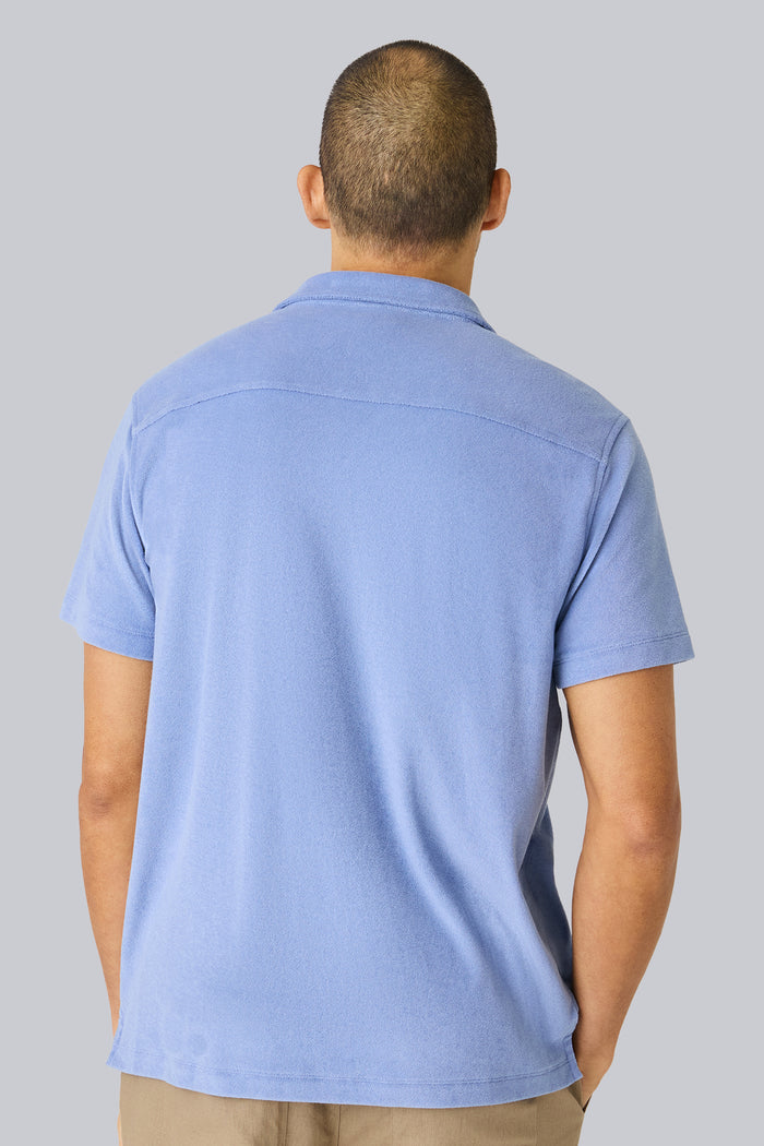 Back view of a man wearing Terry Cloth Short Sleeve Button Up in Desert Spring