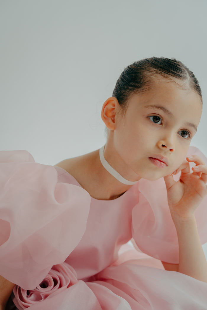 Girl dreaming in a pink puffy erica dress