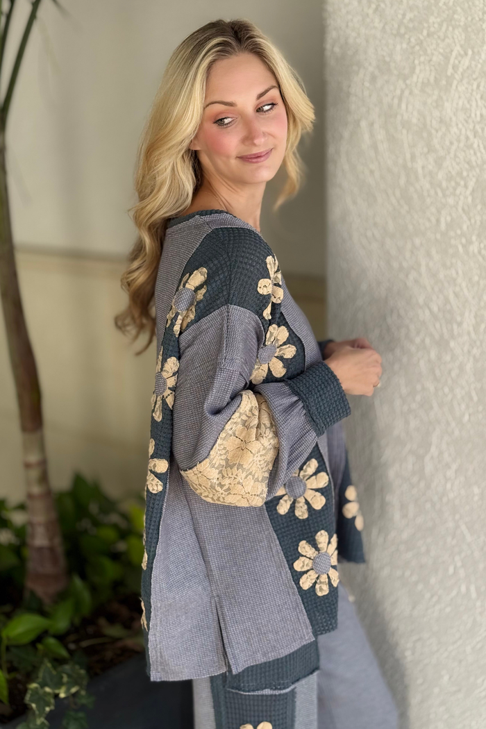 Textured waffle knit top with floral lace sleeves