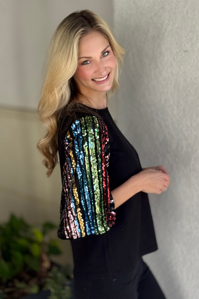 THML sparkle sleeve blouse styled with black pants