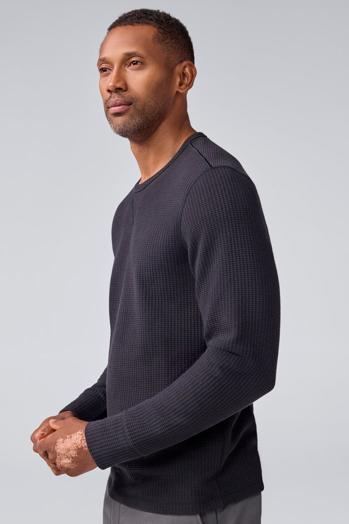 Side view of a man wearing Warmknit Waffle Crew in True Black