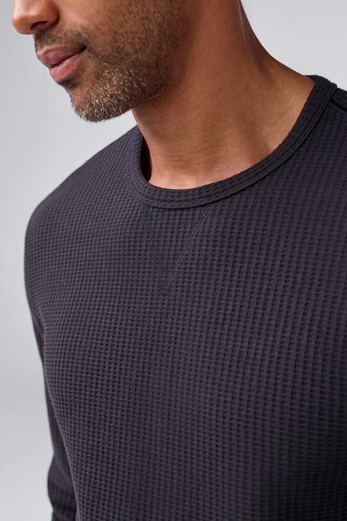 Detailed view of a man wearing Warmknit Waffle Crew in True Black