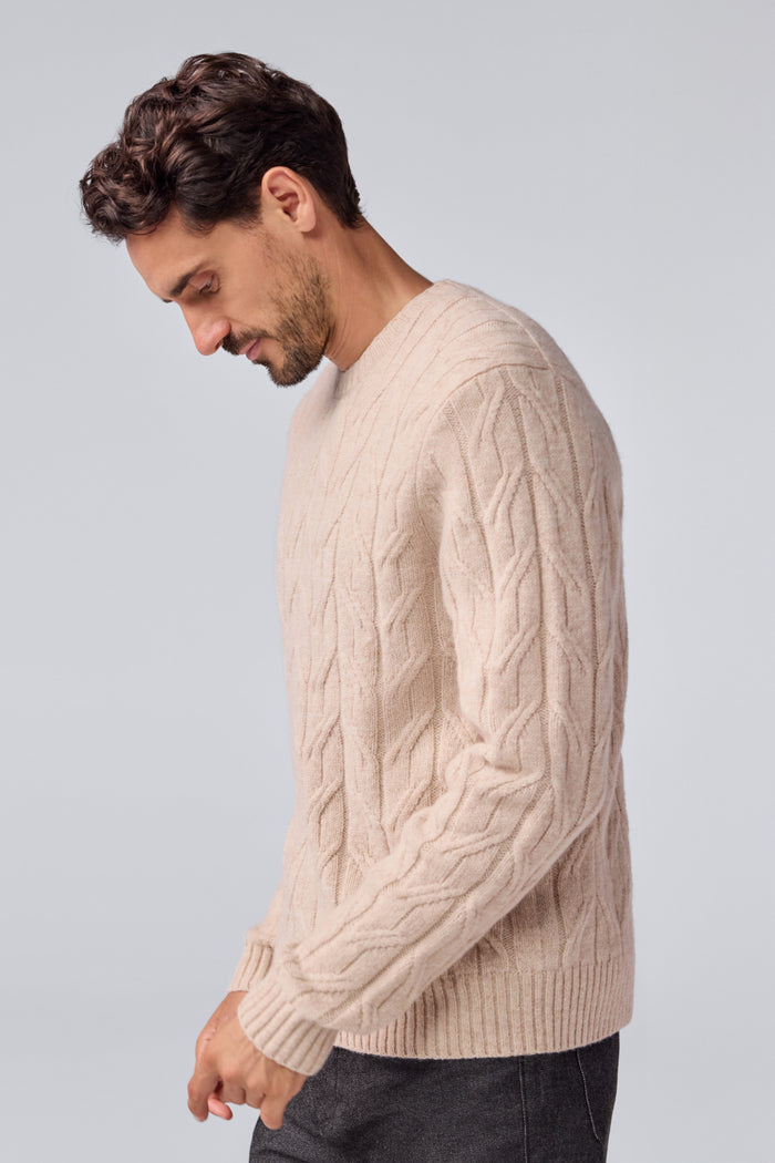 Side view of a man wearing WARMKNIT Wool Crew Neck Sweater in Oatmeal Heather